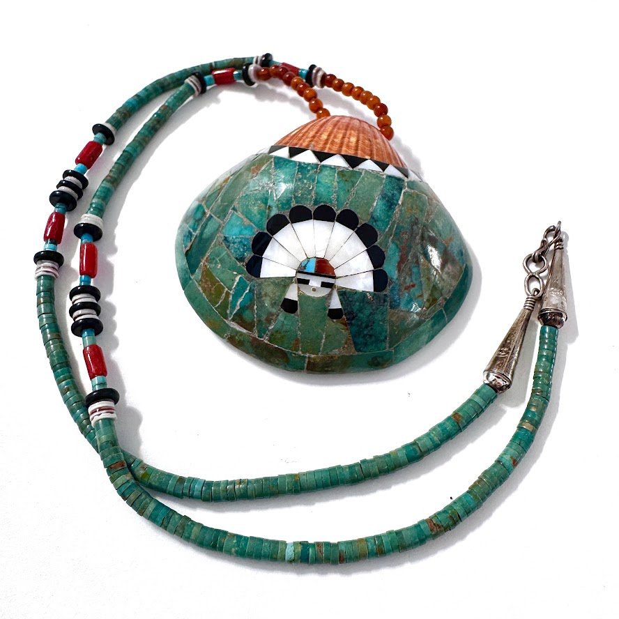 Zuni Spirits is proud to represent a variety of Zuni fetish carvers, including Sarah Leekya (d.)(beading) and Juana Homer (Pendant Inlay)|Jet Shell & beadwork Shell & beadworkInlaid Shell Pendant with Sunface on 31