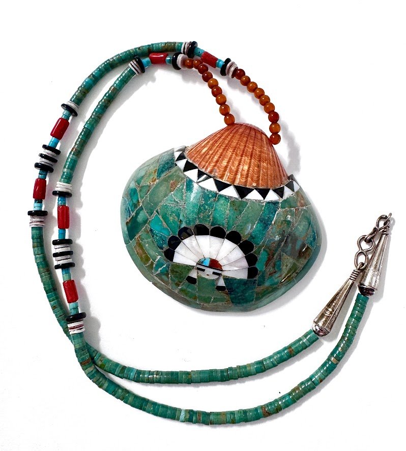 Zuni Spirits is proud to represent a variety of Zuni fetish carvers, including Sarah Leekya (d.)(beading) and Juana Homer (Pendant Inlay)|  Shell & beadworkInlaid Shell Pendant with Sunface on 31