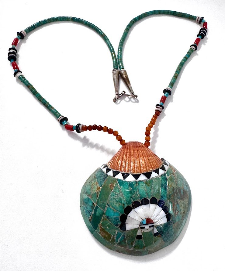 Zuni Spirits is proud to represent a variety of Zuni fetish carvers, including Sarah Leekya (d.)(beading) and Juana Homer (Pendant Inlay)|  Shell & beadworkInlaid Shell Pendant with Sunface on 31